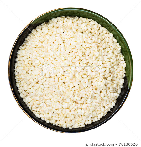 white sesame seeds in round bowl isolated white sesame seeds in round bowl isolated 78130526