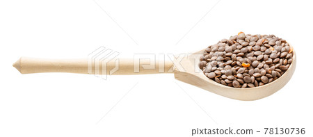 wooden spoon with unhulled red lentils isolated 78130736