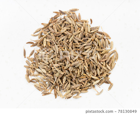 pile of cumin (cuminum cyminum) seeds close up 78130849