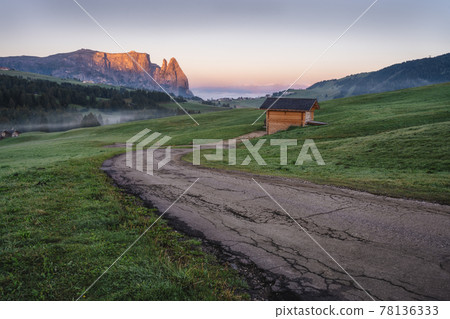 Alpe di Siusi or Seiser Alm, mountain path and Sciliar or Schlern mountain in sunrise light. Dolomites Alps, Trentino Alto Adige South Tyrol, Italy, Europe Alpe di Siusi or Seiser Alm, mountain path and Sciliar or Schlern mountain in sunrise light. Dolomites Alps, Trentino Alto Adige South Tyrol, Italy, Europe 78136333