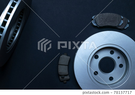 Car engine parts. Auto motor mechanic spare or automotive piece on black background. New metal car part. Flat lay, top view, copy space. 78137717