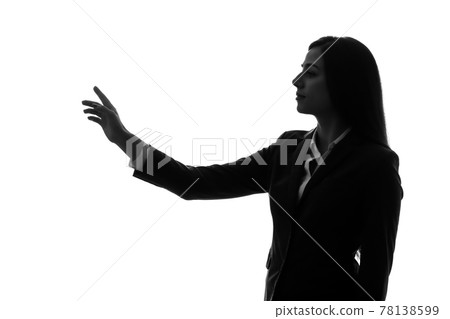 Silhouette of a woman pointing 78138599