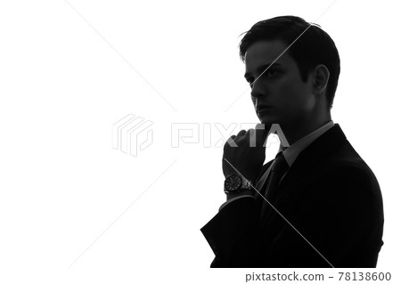 A thinking businessman's silhouette A thinking businessman's silhouette 78138600