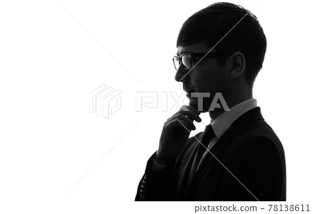 A thinking businessman's silhouette A thinking businessman's silhouette 78138611