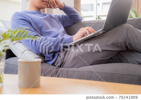Asian Business Using Laptop Computer Online Working from Home 78141909