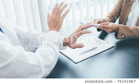 Businessman refusing money in the envelope to agreement contract, Bribe and corruption concept 78141967