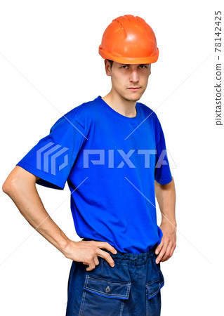 Studio portrait of a confident worker in a construction helmet looking at the camera and holding his 78142425