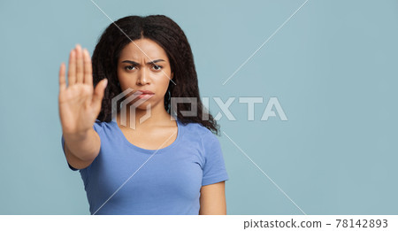 No discrimination. African american woman showing stop gesture to camera over blue background, panorama No discrimination. African american woman showing stop gesture to camera over blue background, panorama 78142893