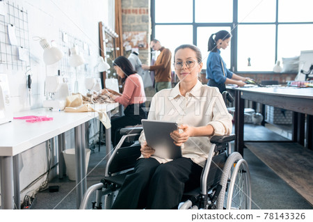 Young successful fashion designer in wheelchair 78143326