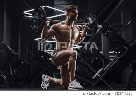 athletic man pumping doing lunges exercises in gym athletic man pumping doing lunges exercises in gym 78144183