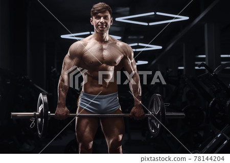 athletic man exercising pumping up biceps muscles athletic man exercising pumping up biceps muscles 78144204