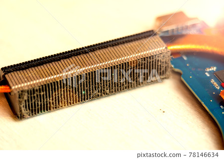 Dusty heatsink on laptop motherboard, removing dust in computer cooling system Dusty heatsink on laptop motherboard, removing dust in computer cooling system 78146634