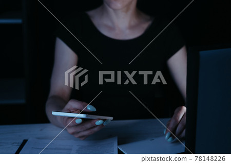 Woman writing the text message late in the night 78148226
