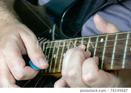 Close-up of man playing lead guitar solo Close-up of man playing lead guitar solo 78149887