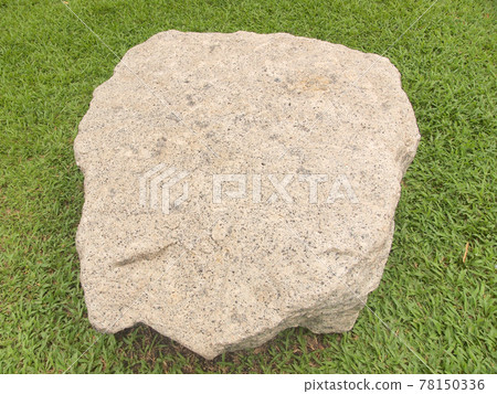 big stone on the grass 78150336