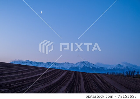 Biei Town in Spring The hills and crescent moon before dawn Biei Town in Spring The hills and crescent moon before dawn 78153655