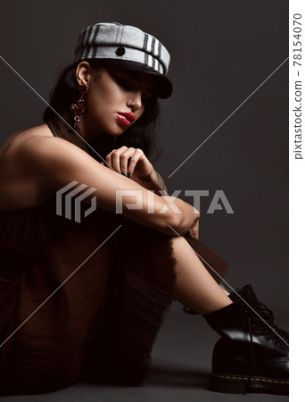 Portrait of young brunette woman with tattoo and Portrait of young brunette woman with tattoo and 78154070