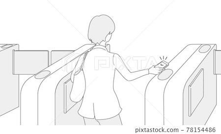 A woman passing by holding her smartphone over the automatic ticket gate 78154486