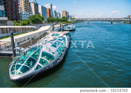 Tokyo cityscape of Japan Sumida River and water buses "Emeraldas" and "Hotaruna". Limited express in the back 78154705