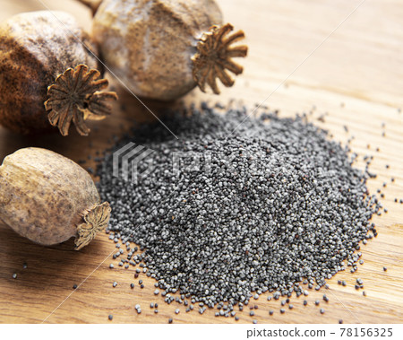 Poppy seeds on the table 78156325