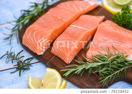 Fresh salmon fish, Raw salmon filet with lemon rosemary herbs and spices 78158452