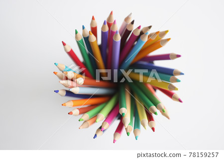 Multi-colored pencils are in organizer top view 78159257