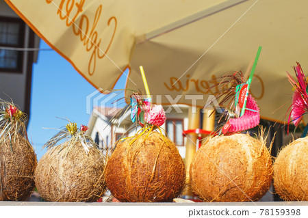 a Tropical coconut cocktails on the coast a Tropical coconut cocktails on the coast 78159398