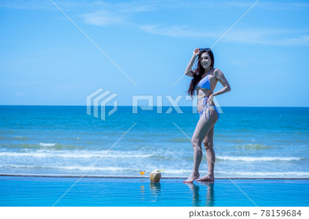 Portrait beautiful young  model asian woman wearing swimming suite  bikini  posing sexy feel happy on the sea ocean beach for leisure travel vacation on summer season 78159684