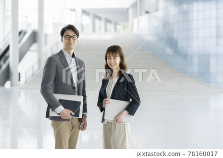 Business person male and female portrait 78160017