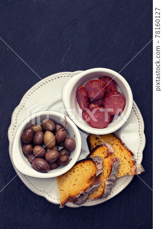 olives with smoked sausages and corn bread olives with smoked sausages and corn bread 78160127