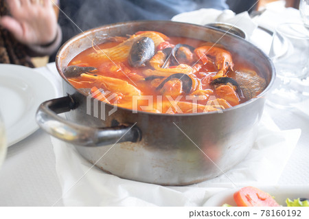 portuguese fish stew in iron pot portuguese fish stew in iron pot 78160192