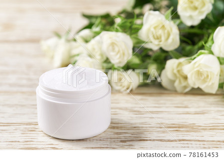 Moisturizing cream for sensitive skin, spa cosmetic and natural clean skincare product on a background of white roses. Moisturizing cream for sensitive skin, spa cosmetic and natural clean skincare product on a background of white roses. 78161453
