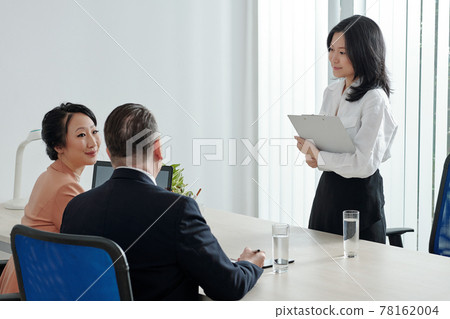 Business people gathering in meeting room Business people gathering in meeting room 78162004