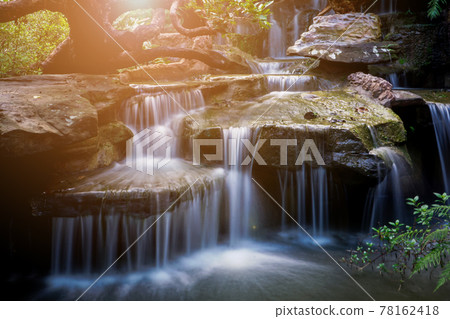 Blurred background,The waterfall at Wat Tham Pha Daen in Sakon Nakhon Province is a new tourist destination. Blurred background,The waterfall at Wat Tham Pha Daen in Sakon Nakhon Province is a new tourist destination. 78162418