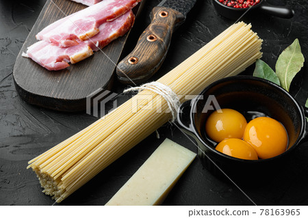 Carbonara pasta ingredients, on black stone background Carbonara pasta ingredients, on black stone background 78163965