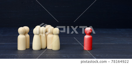 red figurine of a man among the crowd on a blue background. The concept of searching for employees, talented people red figurine of a man among the crowd on a blue background. The concept of searching for employees, talented people 78164922