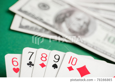 Straight from six to ten during poker with dollars on green table. Straight from six to ten during poker with dollars on green table. 78166865