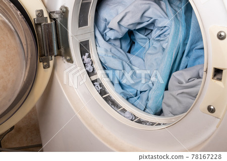 Lint from fabric trapped on laundry dryer filter Lint from fabric trapped on laundry dryer filter 78167228