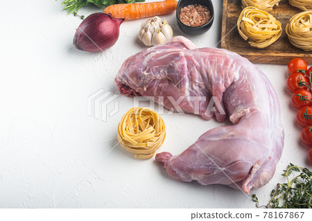 Rabbit stew tagliatelle ingredients, on white stone background, with copy space for text Rabbit stew tagliatelle ingredients, on white stone background, with copy space for text 78167867