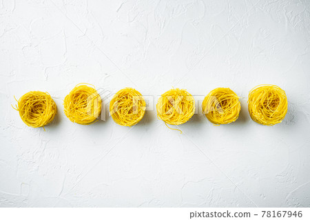 Angel hair pasta, on white stone surface, top view flat lay, with copy space for text Angel hair pasta, on white stone surface, top view flat lay, with copy space for text 78167946