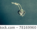 Heart pendant necklace symbol of love Romance Valentine's Day Closeup shoot in a summer day. Selective Focus 78169960