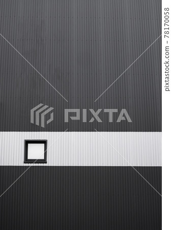 Black and white corrugated iron sheet used as a facade of a warehouse or factory with a window. Texture of a seamless corrugated zinc sheet metal aluminum facade. Architecture. Metal texture. 78170058