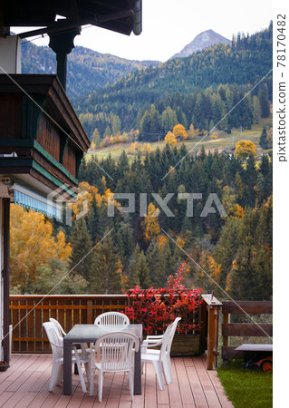 cozy terrace with a table and chairs cozy terrace with a table and chairs 78170482