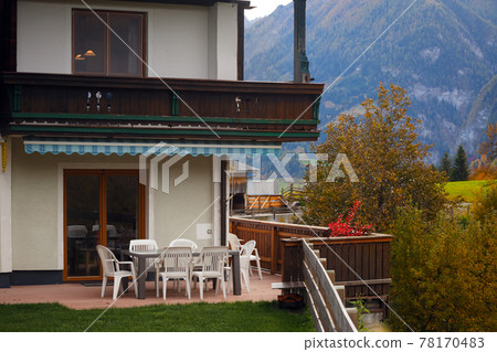 cozy terrace with a table and chairs cozy terrace with a table and chairs 78170483