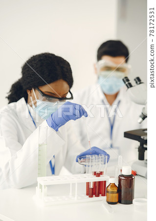 Researchers creating vaccine for covid-19 in a lab Researchers creating vaccine for covid-19 in a lab 78172531