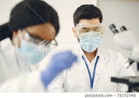 Researchers creating vaccine for covid-19 in a lab 78172548