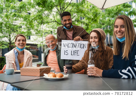 Reunion of family outdoors in city, life after covid-19 vaccination and back to normal concept. 78172812