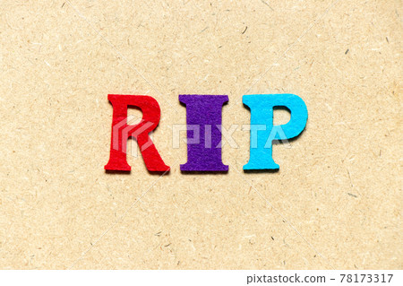 Color cloth alphabet letter in word RIP (abbreviation of rest in peace) on wood background Color cloth alphabet letter in word RIP (abbreviation of rest in peace) on wood background 78173317