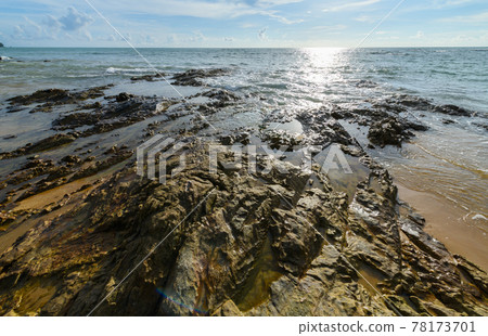 Rock and black sand at Nangthong natural black beach in thailand 78173701