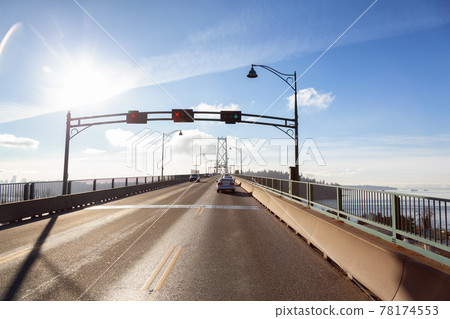 Drive across the famous Lions Gate Bridge in the modern Downtown City. Drive across the famous Lions Gate Bridge in the modern Downtown City. 78174553